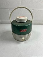 Front view of Coleman jug showing body, spigot, handle