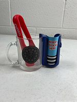 Mug, rack and tongs grouped together