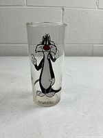 Front view of glass showing Sylvester graphic and base condition