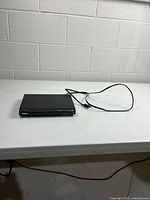 Player on table, power cord visible