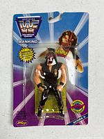 Front view of sealed WWF Bend-Ems Mankind action figure on original card