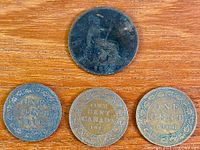 All four coins front view
