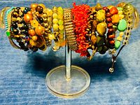 Full view of all bracelets on acrylic display stand