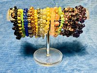 Full view of all bracelets on acrylic stand