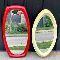Front view of both mirrors leaning against wall
