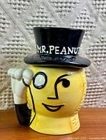 Front view of Mr. Peanut ceramic jar with lid in place
