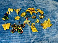 Group shot showing entire assortment of brooches