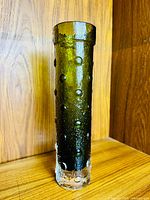 Full view of tall olive green bubble vase showing gradient color and texture