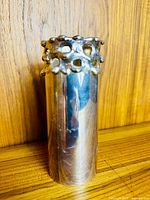 Front view of silver-plated Danish vase showing brutalist rim and cylindrical body