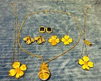 All jewelry items laid out on blue background