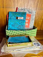 Box with albums, envelope, plastic bag of stamps