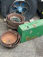 Group shot showing stove, nested cast iron basins, and ceramic bowl