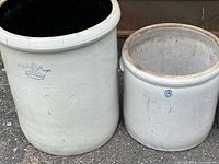 Both crocks side by side showing size difference, exterior glaze and markings