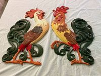 Front view of both rooster plaques showing colors and mirrored design