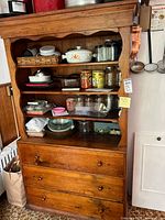 Full front view of solid wood hutch showing open shelves and three drawers, dimensions inferred