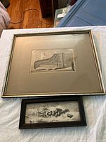 Front view of both framed prints showing relative sizes and subjects