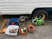 Group shot showing all garden tools, watering cans, pots and containers