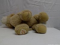 Underside showing Disney The Lion King and BAB paw pad logos