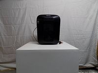 Front view of Fellowes LX41-RS shredder on pedestal