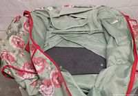 Interior view showing lining, mesh pocket and base insert