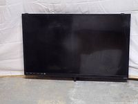 Front view of VIZIO flat-screen TV powered off