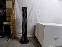 Full view of Vornado tower fan standing upright