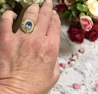 Ring on hand showing scale, stone, gold wash finish