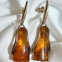 Front view showing full design, silver setting and amber stones