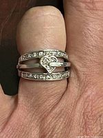 ring on finger showing design and diamonds