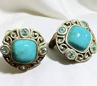 front view showing turquoise cabochons and surrounding blue stones