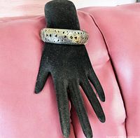 Bracelet displayed on mannequin hand showing overall design