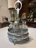 Front view of complete cruet set on stand