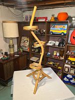 full frontal view of bamboo three-tier plant stand showing overall structure