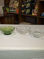 Full view of the three glass candy dishes side by side on table