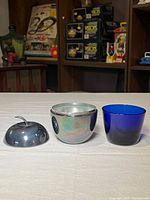 Apple container opened showing glass liner and lid