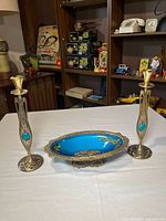 Full set: two brass/enamel candlesticks and matching pedestal bowl