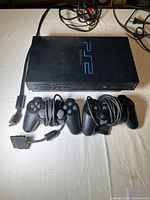 Console, two controllers, AV cable, power cord, memory card displayed