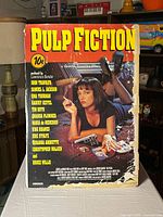 Front view of entire Pulp Fiction poster on board