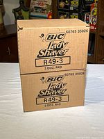 Two sealed Bic Lady Shaver cardboard cases stacked
