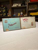 Front view of both tins closed