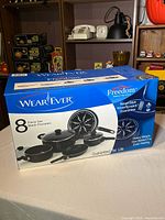 Sealed box front showing WearEver Freedom 8-piece set image and features