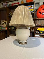 Lamp with shade on table