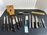 Full layout of all cutlery, block and strip on black backdrop
