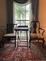 Front view of both chairs and tray table against window