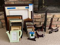 Full lot showing frames stacked by size and assorted display stands