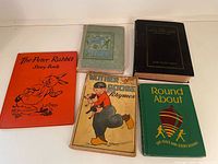 Front covers of all five books laid out