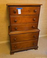 Front view of chest-on-chest dresser, drawers closed