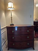 Dresser front view with lamp on top
