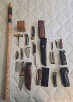 Overview: walking stick, trinket box, corkscrew, knives and sheaths laid out