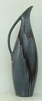 Full view of tall slate blue drip glaze pitcher